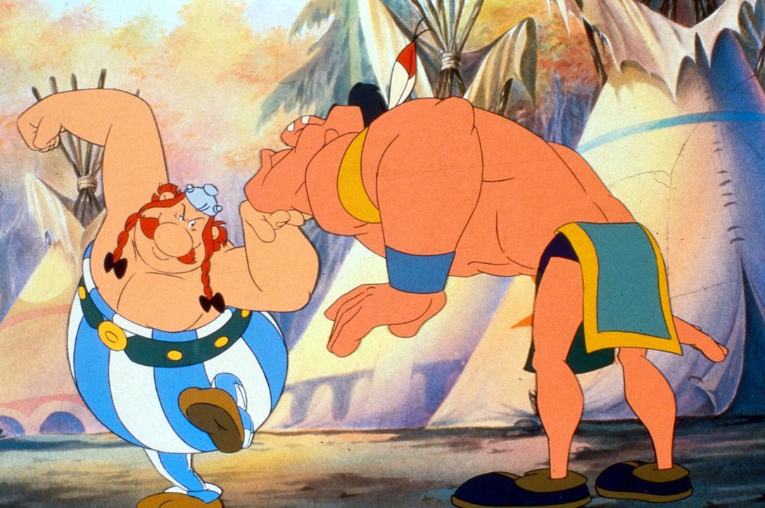 Wird Obelix (l.) den stärksten Krieger (r.) des Indianerstammes besiegen? - Bildquelle: Jugendfilm-Verleih GmbH